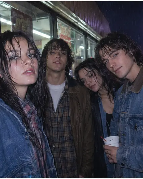 1990s rainy corner-store group photo with disposable camera flash